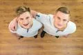 The two twin brother smile to the camera. View from above Photo