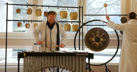Two twin men percussionists playing percussion instrument during happy day Video stock 103270138
