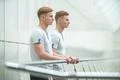 The two twin stand on the office balcony Photo