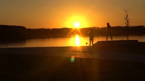 Two two young women on the evening lake Видео 79664147