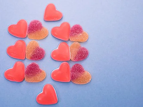 Two types of candy hearts with light blue background Stock Photos