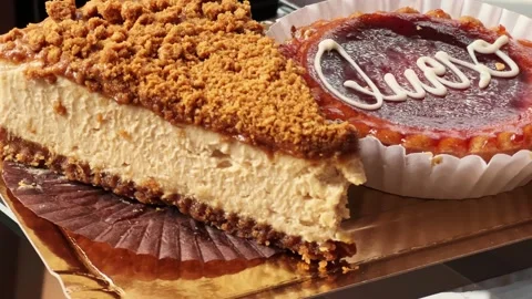 Two types of cheesecakes close-up on a table in a coffee shop. Stock Footage 300490695