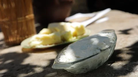 Two types of cheeses served on the rustic table. Stock Footage 197376718