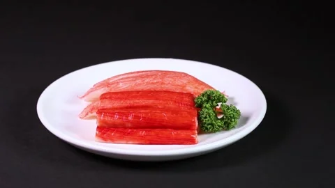 Two types of crab sticks on a plate, rotating Stock-Footage 302038713