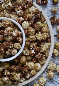 Two types of flavored popcorn in two round plates Stock Photos