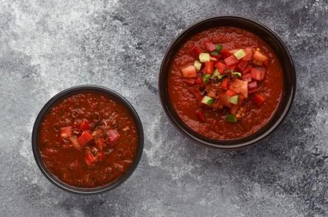 Two types of gazpacho soup on stone background top view. 写真素材