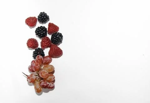 Two types of grapes on a white background with a place for tex Stock Photos