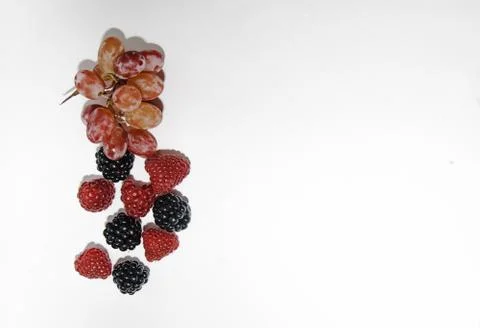 Two types of grapes on a white background with a place for tex Stock Photos