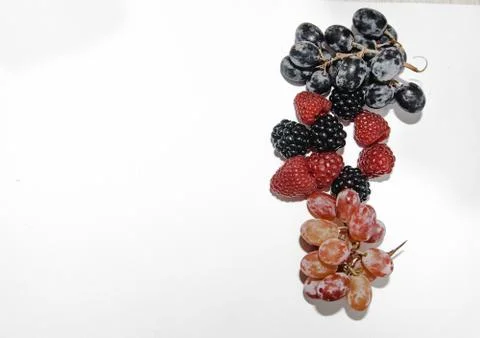Two types of grapes on a white background with a place for tex Stock Photos