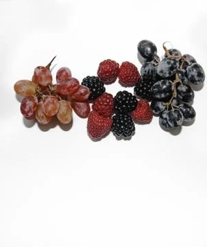 Two types of grapes on a white background with a place for tex Stock Photos