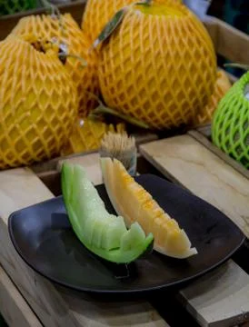 Two types of melon on dish Stock Photos