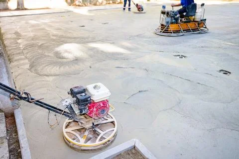 Two types of power trowel with engine, machine for finishing, leveling conc.. Foto stock