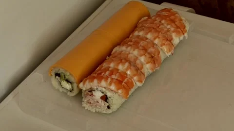 Two types of sushi lie on a plate close-up in the video Stock Footage 285250563