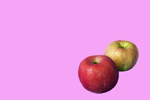Two typical Asian apples, and a pink background Stock Photos
