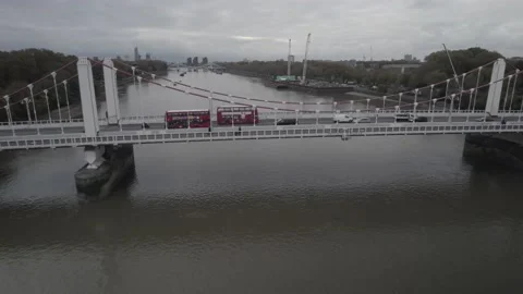Two typical red double deckers passing by each other on Chelsea Bridge Video stock 167869673