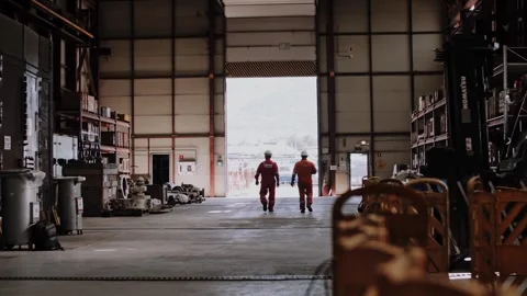 Two unidentified workers in a factory workshop. Stock Footage 316161656