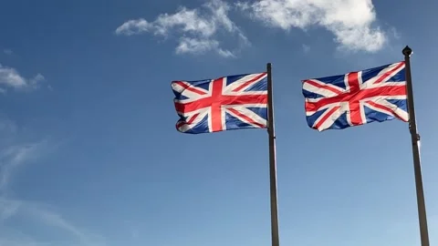 Two Union flags, light breeze, Blue sky, clouds Stock Footage 213940319