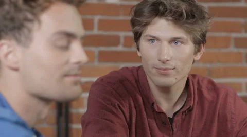 Two university students working on project together in loft modern interior Vidéo 67671679