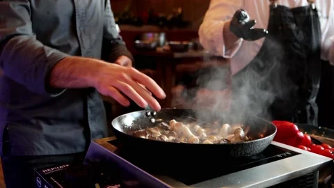 Two unrecognizable chefs are preparing food at cooking class, close-up. Stock Footage 179049135