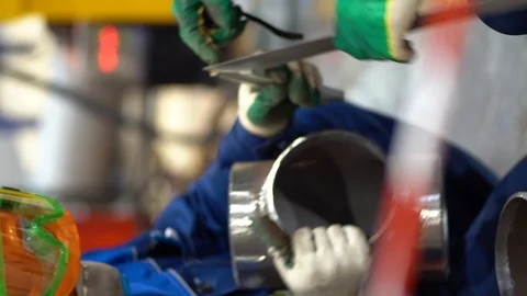 Two unrecognizable locksmiths working, examining and checking metal pipes Stock Footage 126358216