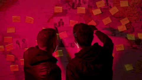 Two unrecognizable young men looking at wall map Stock Footage 181792805