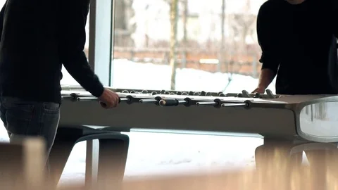 Two unrecognizable young men playing table football game. 4K video Stock Footage 73072104