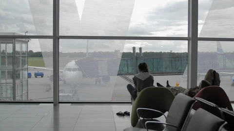 Two unrecognized passengers rest, lie in the rest area of the airport terminal Video stock 108065104