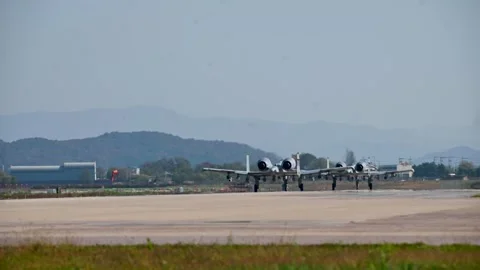 Two U.S. Air Force A-10 Thunderbolt II aircraft taxiing for take-off  Stock Footage 254678609