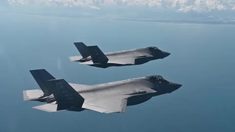 Two U.S. Air Force F-35 Lightning II aircraft flying side by side Stock Footage 253997967