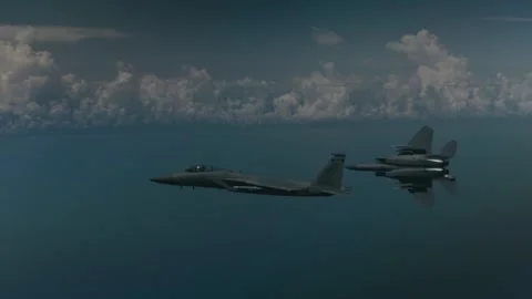 Two U.S. Air Force F-15C Eagle aircraft peeling away Stock Footage 300261579