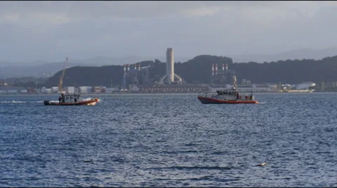 Two US Coast Guard boats meet in harbor bay Stock Footage 33472118