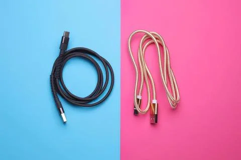 Two usb cables on colorful background for technology and gadgets Stock Photos