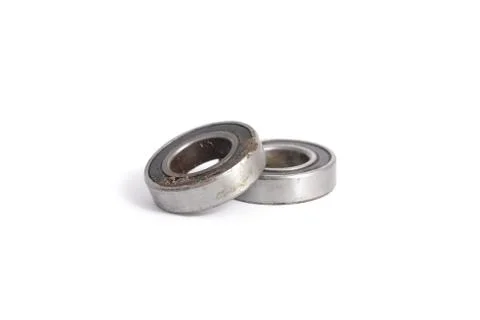 Two used useless and dirty radial bearings Stock Photos