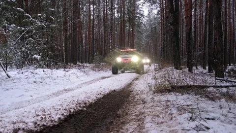 Two utv sxs off-road buggies are riding in the evening dusk forest. Stock Footage 188560986