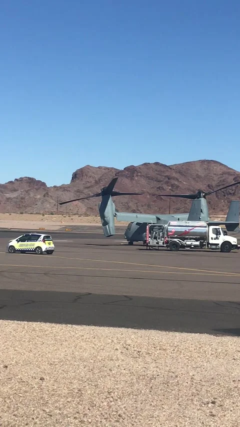 Two V-22 Osprey Helicopters fueling up while running Stock Footage 250994833