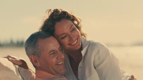 Two Vacation Lovers Smiling at the Beach Stock Footage 262388723