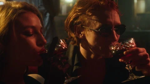 Two Vampire Lovers Laughing and Drinking Blood, Sharing Lively, Intimate Moment Video stock 303986087