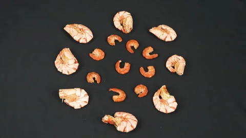 Two Varieties Of Dried Shrimp Rotating On Black Background Stock Footage 337783179