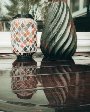 Two Vases on a Wet Table Reflecting Off of It Stock Photos