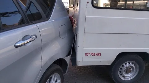 Two vehicles accidentally collide in broad daylight, Olongapo City, Video stock 123946704