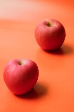 Two vertical apple up and down top bottom monkey back Stock Photos
