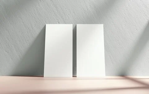 Two vertical flyer mockup blank paper leaning on a wall for design presentati Stock Photos