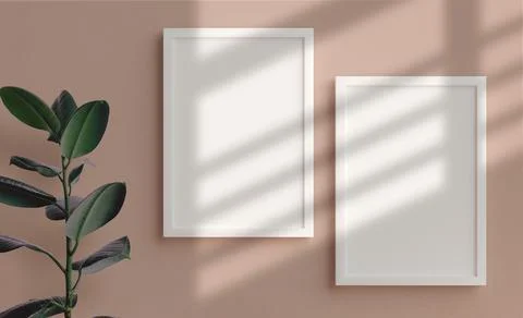 Two vertical picture frames mockup in white hanging on the wall in 3D renderi Stock Photos