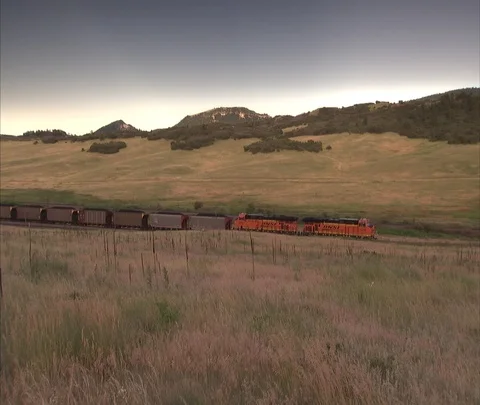Two very long coal trains pass each other Video stock 86692201