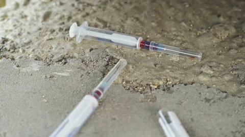 Two vials and syringes used by drug addicts are not concrete slab Stock Footage 67904436