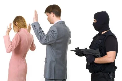 Two victims standing with their hands raised while mafia representative pointing Stock Photos