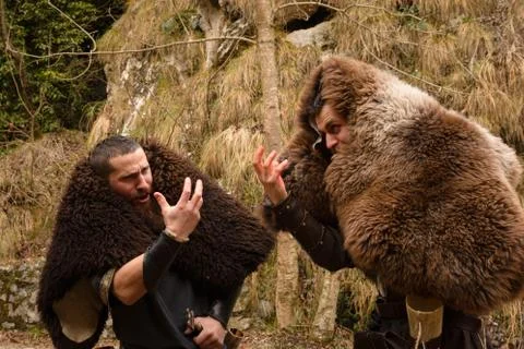 Two Viking explorers, after a long journey, enjoy singing Stock Photos