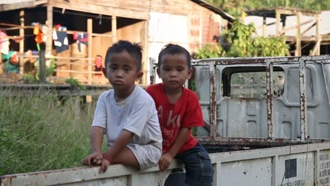 Two Village children looking at the camera, Malaysia Stock Footage 95352404