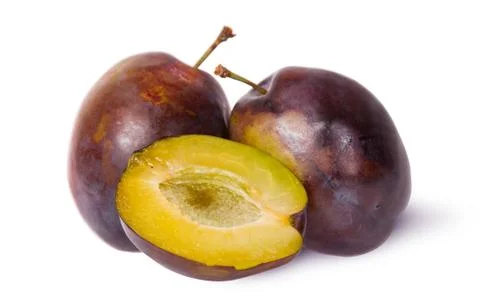 Two violet plums and half Stock Photos