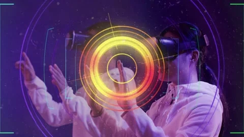 Two VR users raising hands in lab, HUD aligning, centering reticle, cycling hues Stock Footage 335465599